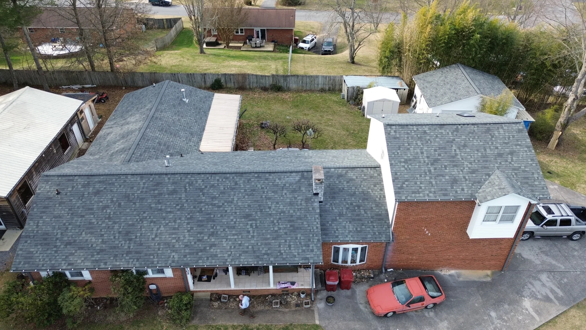 Detailed aerial view of shingle roof valleys and transitions