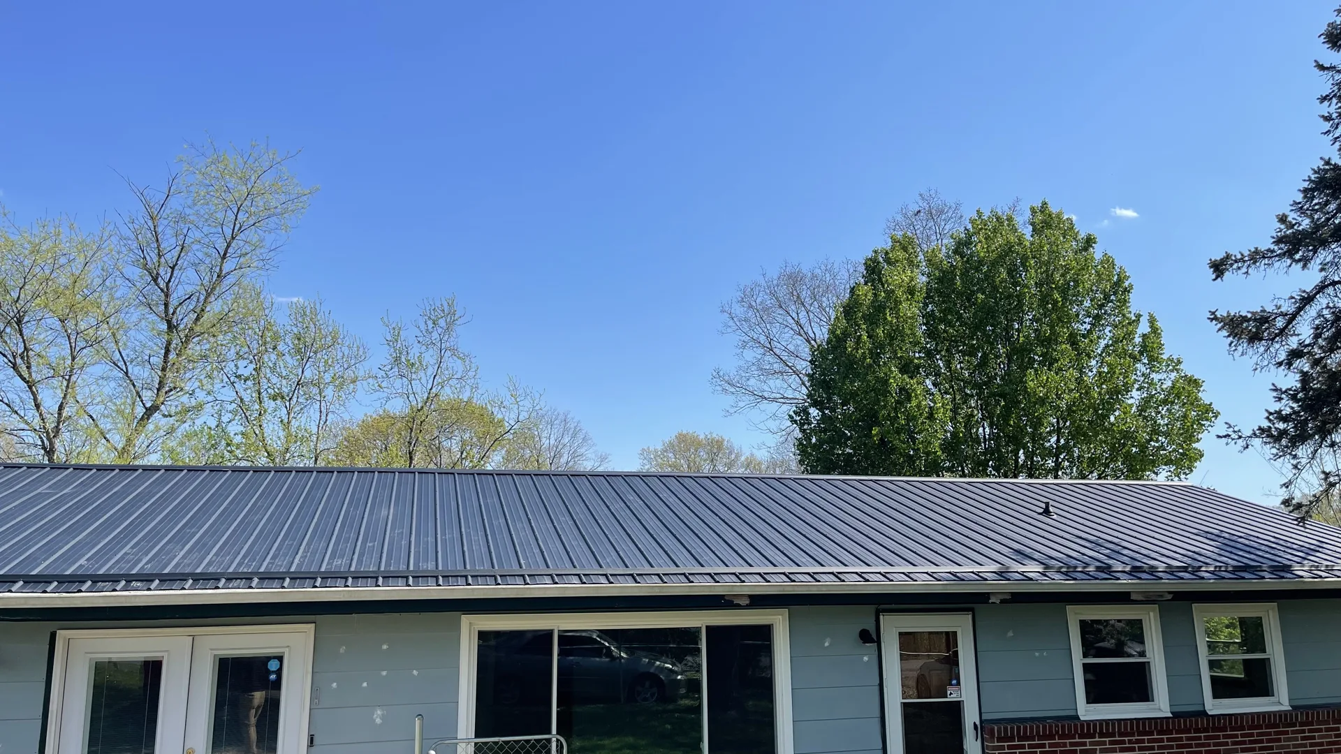 Dark metal roofing on a single-story home